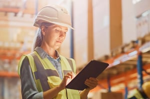An associate checks inventory levels in the warehouse.