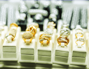 Diamonds and gold rings on display at a specialty jeweler using OnePint’s predictive sourcing tools