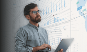 A supply chain analyst looking at data benefits from demand forecasting.